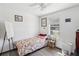 Bedroom with single bed, ceiling fan and window with blinds at 1055 Philippe Pkwy, Safety Harbor, FL 34695