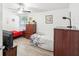 Small bedroom with two beds, dresser, and a TV at 1055 Philippe Pkwy, Safety Harbor, FL 34695