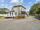 Two-story house with deck, exterior stairs, and a basketball hoop at 1055 Philippe Pkwy, Safety Harbor, FL 34695