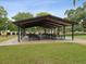 Park pavilion with picnic tables under a shaded structure at 1055 Philippe Pkwy, Safety Harbor, FL 34695