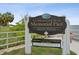 A sign welcoming visitors to Fire Marshal Dick Brock Memorial Pier at 1055 Philippe Pkwy, Safety Harbor, FL 34695