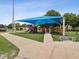 Modern playground with shade structure and accessible pathway at 1055 Philippe Pkwy, Safety Harbor, FL 34695