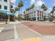 Quaint town square with palm trees and brick pedestrian area at 1055 Philippe Pkwy, Safety Harbor, FL 34695