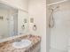 Clean bathroom with shower and tiled countertop at 106 Edgewood Ct, Oldsmar, FL 34677