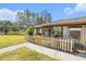 Condo exterior with a white picket fence and walkway at 106 Edgewood Ct, Oldsmar, FL 34677