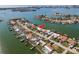 Aerial view showing home's waterfront location and surrounding properties at 11651 Grove St, Seminole, FL 33772