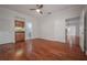 Hardwood floor bedroom with wet bar and built-in shelving at 12908 Cinnimon Pl, Tampa, FL 33624