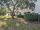 Townhouse exterior with tree and landscaping at 1294 Clays Trl # 1294, Oldsmar, FL 34677