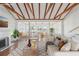 Bright and airy living room featuring vaulted ceilings, hardwood floors, and water views at 14157 N Bayshore Dr, Madeira Beach, FL 33708