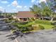 Lake Forest Clubhouse with inviting exterior and landscaping at 14926 Lake Forest Dr, Lutz, FL 33559