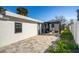 Newly paved backyard patio with modern pergola at 15804 Redington Dr, Redington Beach, FL 33708