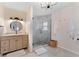 Elegant bathroom with a large walk-in shower and modern vanity at 15804 Redington Dr, Redington Beach, FL 33708