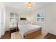 Charming bedroom with hardwood floors and plenty of natural light at 15804 Redington Dr, Redington Beach, FL 33708