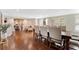 Spacious dining room with hardwood floors and views of the kitchen at 15804 Redington Dr, Redington Beach, FL 33708