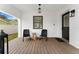 Inviting front porch with two wicker chairs and wooden flooring at 15804 Redington Dr, Redington Beach, FL 33708