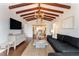 Bright living room featuring hardwood floors and views into the kitchen at 15804 Redington Dr, Redington Beach, FL 33708
