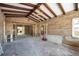 Large living room undergoing renovation with exposed beams at 15804 Redington Dr, Redington Beach, FL 33708