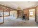 Open living area with exposed beams and hardwood floors at 15804 Redington Dr, Redington Beach, FL 33708