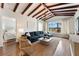 Spacious living room with hardwood floors and exposed beams at 15804 Redington Dr, Redington Beach, FL 33708