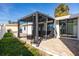 Relaxing patio with modern pergola and brick paving at 15804 Redington Dr, Redington Beach, FL 33708