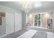 Elegant bedroom with bay window and chandelier at 1598 Lockmeade Pl, Oldsmar, FL 34677