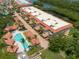 Community pool and spa with lush landscaping at 1695 Pinellas Bayway S # E4, Tierra Verde, FL 33715
