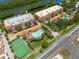 Resort-style community with pool, tennis court, and lush landscaping at 1695 Pinellas Bayway S # E4, Tierra Verde, FL 33715
