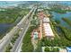 Aerial view of waterfront community with tennis court and pool at 1695 Pinellas Bayway S # E4, Tierra Verde, FL 33715