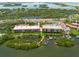 Aerial view of waterfront community with boat docks at 1695 Pinellas Bayway S # E4, Tierra Verde, FL 33715