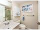 Clean bathroom with shower, toilet, vanity, and wall cabinet at 1695 Pinellas Bayway S # E4, Tierra Verde, FL 33715