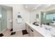 Bathroom with double vanity, glass shower, and tile flooring at 1695 Pinellas Bayway S # E4, Tierra Verde, FL 33715