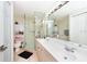 Clean bathroom with double vanity, walk-in shower and tile flooring at 1695 Pinellas Bayway S # E4, Tierra Verde, FL 33715
