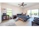 Spacious bedroom with a comfy bed, ceiling fan, and access to a private balcony at 1695 Pinellas Bayway S # E4, Tierra Verde, FL 33715