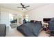 Comfortable bedroom with king-size bed, private bathroom access, and a workspace at 1695 Pinellas Bayway S # E4, Tierra Verde, FL 33715