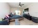 Large bedroom with a king-size bed, TV, and access to a private balcony at 1695 Pinellas Bayway S # E4, Tierra Verde, FL 33715
