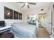 Bedroom with large bed, window, and access to another room at 1695 Pinellas Bayway S # E4, Tierra Verde, FL 33715