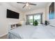 Spacious bedroom with large TV, window, and comfortable bed at 1695 Pinellas Bayway S # E4, Tierra Verde, FL 33715