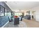 Elegant dining area with a glass table and stone wall at 1695 Pinellas Bayway S # E4, Tierra Verde, FL 33715