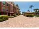 Brick driveway leading to a residential building at 1695 Pinellas Bayway S # E4, Tierra Verde, FL 33715