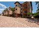 Building exterior showcasing Mediterranean-style architecture and landscaping at 1695 Pinellas Bayway S # E4, Tierra Verde, FL 33715