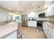 Modern kitchen with stainless steel appliances and light wood flooring at 1695 Pinellas Bayway S # E4, Tierra Verde, FL 33715