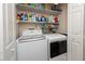 Laundry room with washer, dryer, and ample storage at 1695 Pinellas Bayway S # E4, Tierra Verde, FL 33715