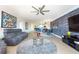 Open living room with kitchen view and comfy seating at 1695 Pinellas Bayway S # E4, Tierra Verde, FL 33715
