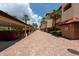 Covered parking garage with brick pavers and landscaping at 1695 Pinellas Bayway S # E4, Tierra Verde, FL 33715
