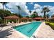 Community lap pool and relaxing areas at 1695 Pinellas Bayway S # E4, Tierra Verde, FL 33715