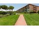Well-manicured walkway leading to waterfront at 1695 Pinellas Bayway S # E4, Tierra Verde, FL 33715