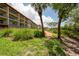 Elevated walkway next to building and lush landscaping at 1695 Pinellas Bayway S # E4, Tierra Verde, FL 33715