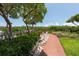 Peaceful waterfront path with natural landscaping at 1695 Pinellas Bayway S # E4, Tierra Verde, FL 33715