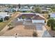 Aerial view of single-Gathering home with a landscaped yard at 1732 Flamingo Ln, Sun City Center, FL 33573