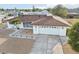 Single-story house with brown roof and driveway at 1732 Flamingo Ln, Sun City Center, FL 33573